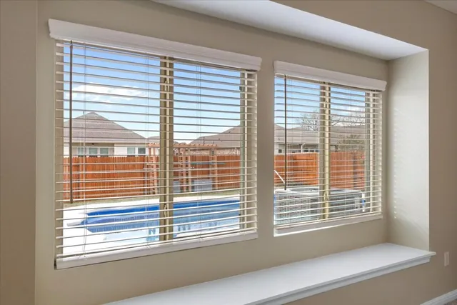 a view of a room that has a large window