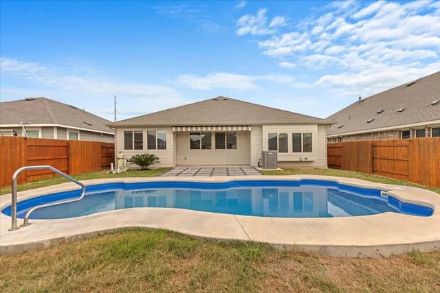 a view of swimming pool with lounge chair