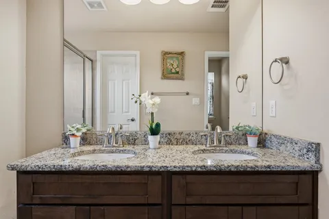 a view of a house with a backyard