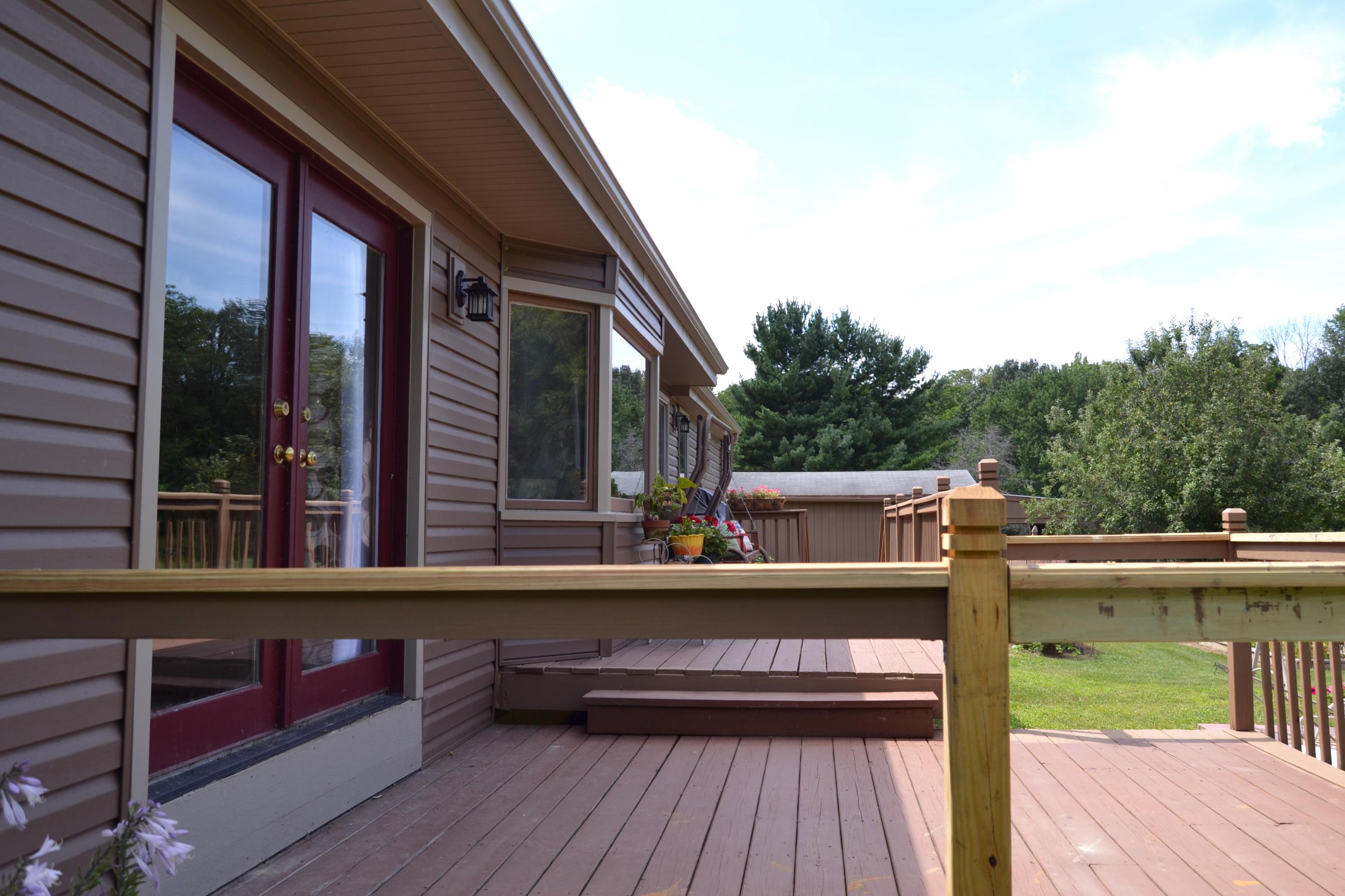 9000 Welsh Road Radnor, OH 43066 - Photo 17 of 28 Closer view of the rear deck with atrium doors and bay window at dinette.