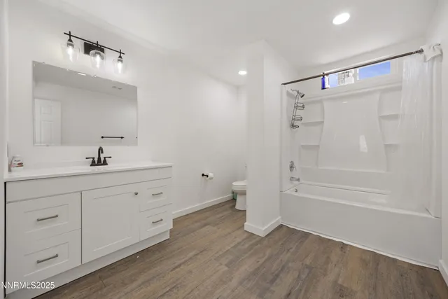 a bedroom with a bed and a potted plant