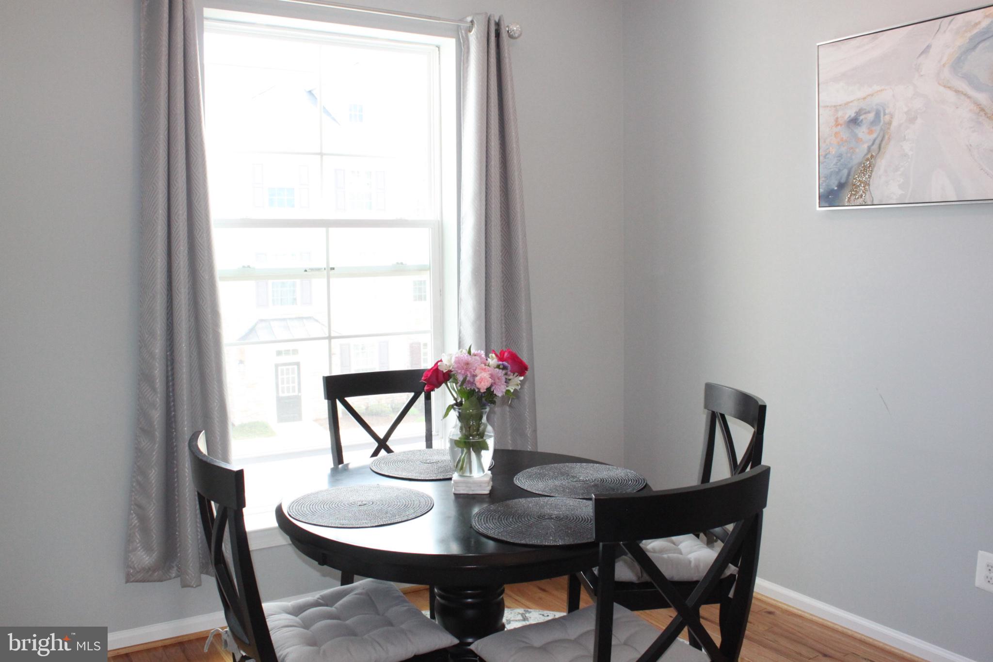 7452 Riding Meadow Way Manassas, VA 20111 - Photo 12 of 22 Bright dining nook with floral charm.