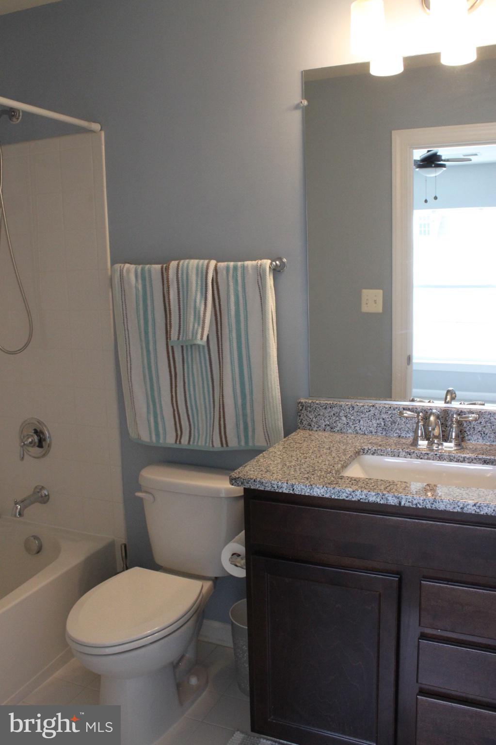 7452 Riding Meadow Way Manassas, VA 20111 - Photo 13 of 22 Modern bathroom with serene hues.