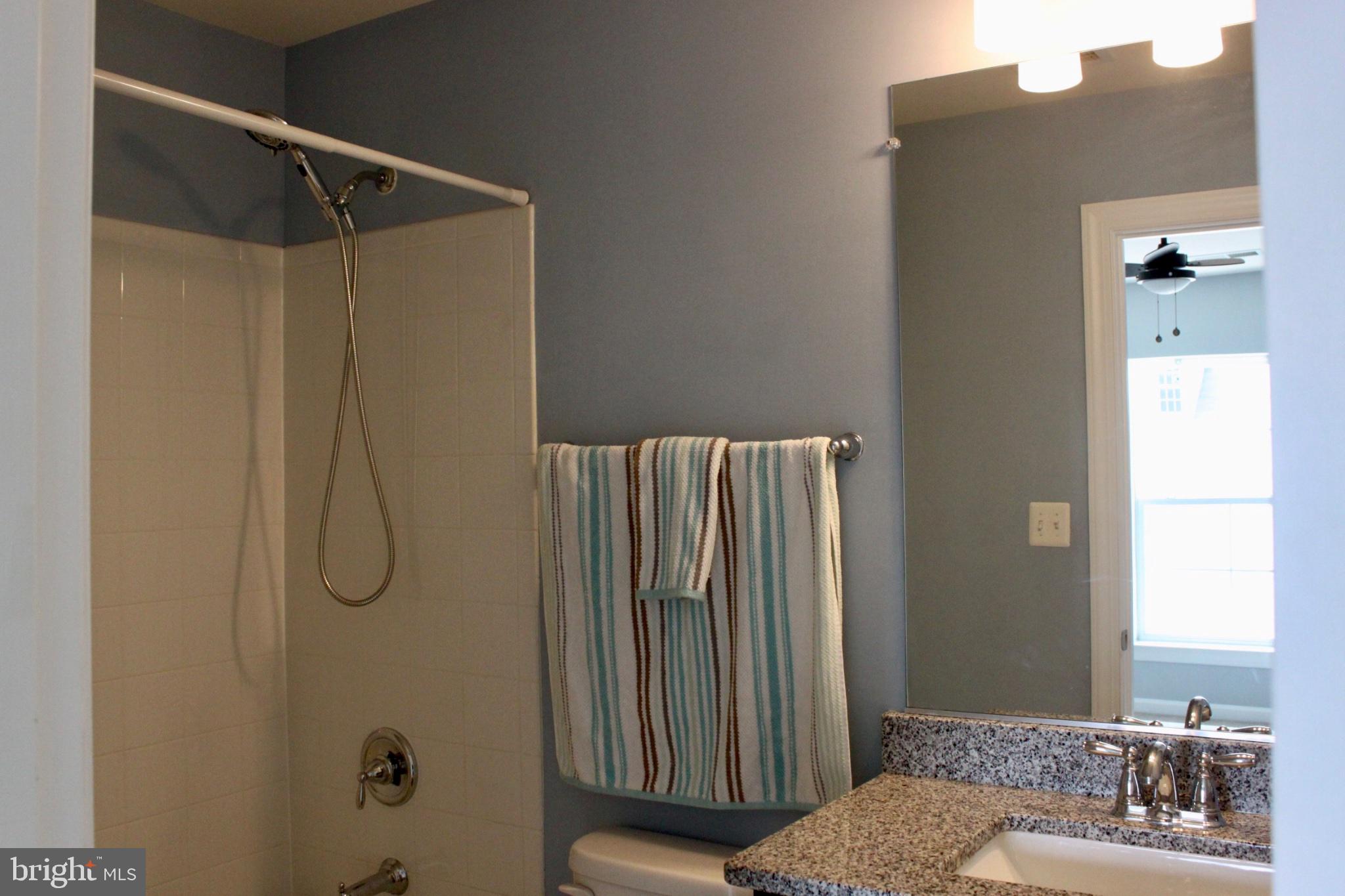 7452 Riding Meadow Way Manassas, VA 20111 - Photo 14 of 22 Modern bathroom with soothing hues.