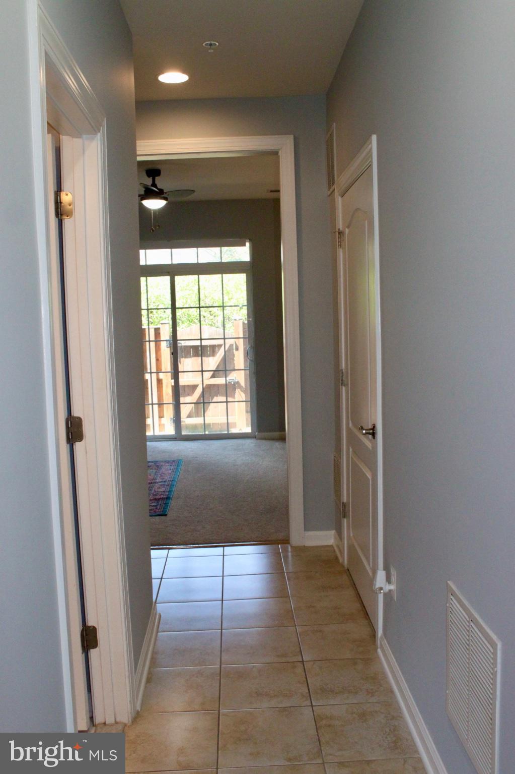 7452 Riding Meadow Way Manassas, VA 20111 - Photo 2 of 22 Inviting hallway with natural light.