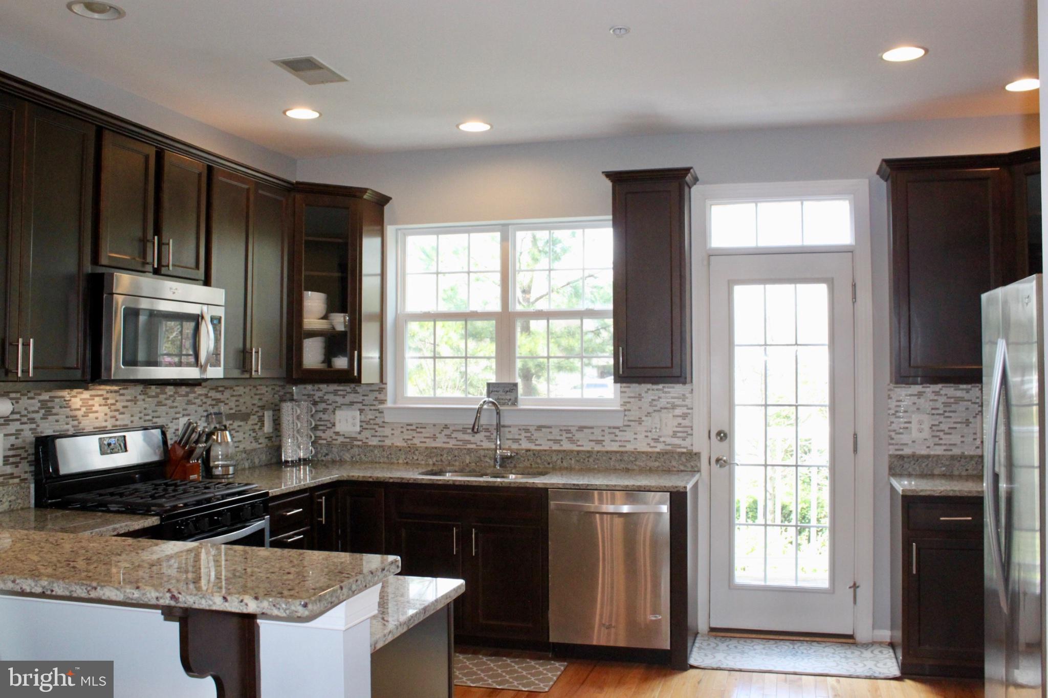 7452 Riding Meadow Way Manassas, VA 20111 - Photo 8 of 22 Modern kitchen with natural light.