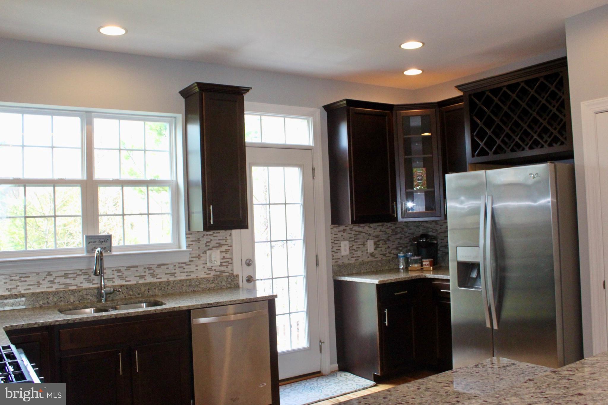 7452 Riding Meadow Way Manassas, VA 20111 - Photo 9 of 22 Modern kitchen with elegant finishes.