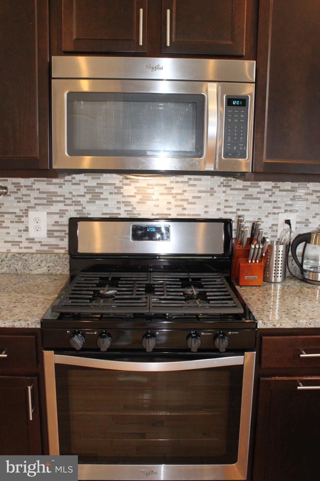 7452 Riding Meadow Way Manassas, VA 20111 - Photo 10 of 22 Sleek kitchen appliances in harmony.