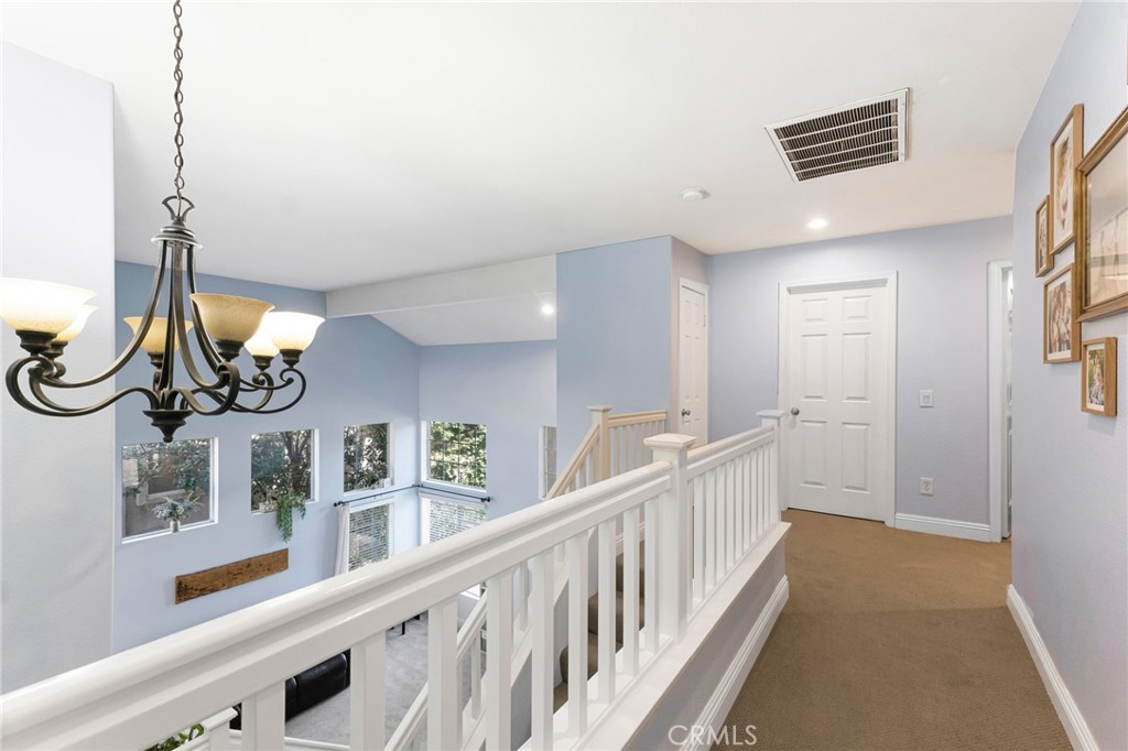 3843 San Gabriel Street Simi Valley, CA 93063 - Photo 31 of 52 a view of a hallway with stairs