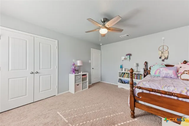 a very nice looking room with a ceiling fan