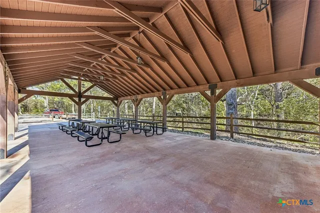 a view of a room with wooden shelves