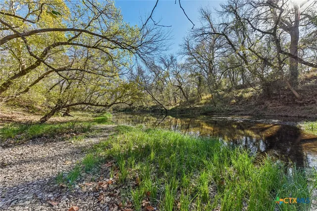 a view of lake with green space