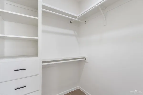 a view of an empty walk in closet