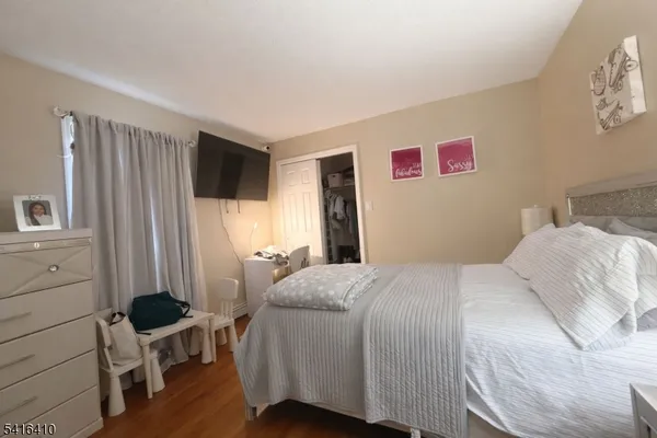 a bedroom with a bed and furniture