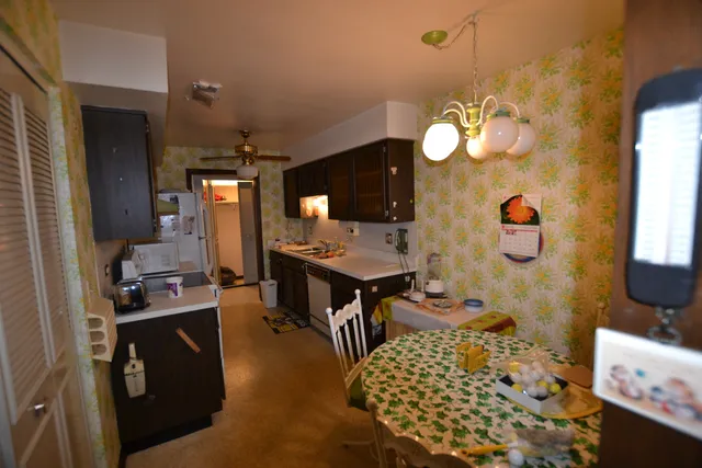 a kitchen with a sink stove and cabinets