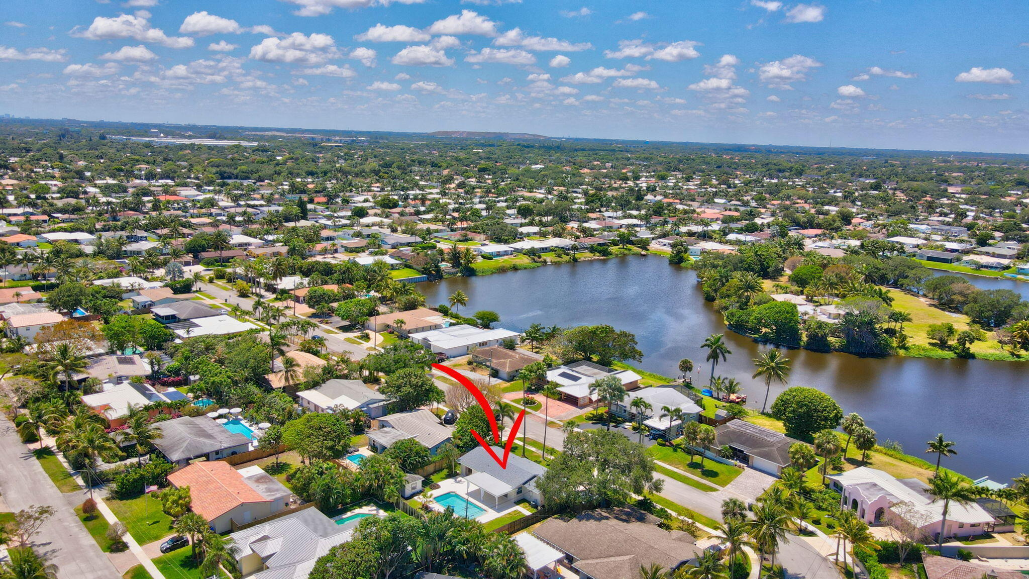 832 Southwest 10th Avenue Boca Raton, FL 33486 - Photo 47 of 57 an aerial view of residential houses with outdoor space and lake view