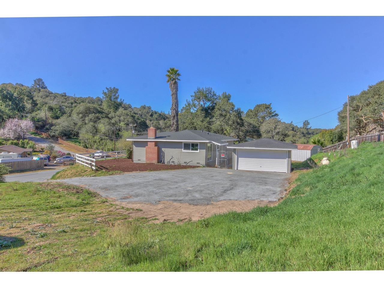 a view of backyard with outdoor and green space