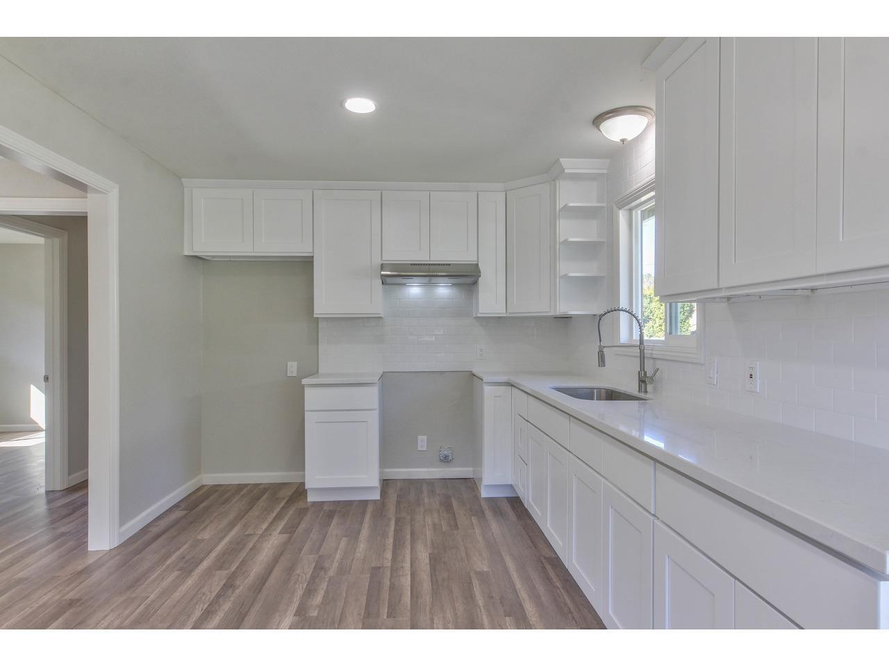 19265 Mallory Canyon Road Salinas, CA 93907 - Photo 3 of 17 a kitchen with a sink a microwave and cabinets