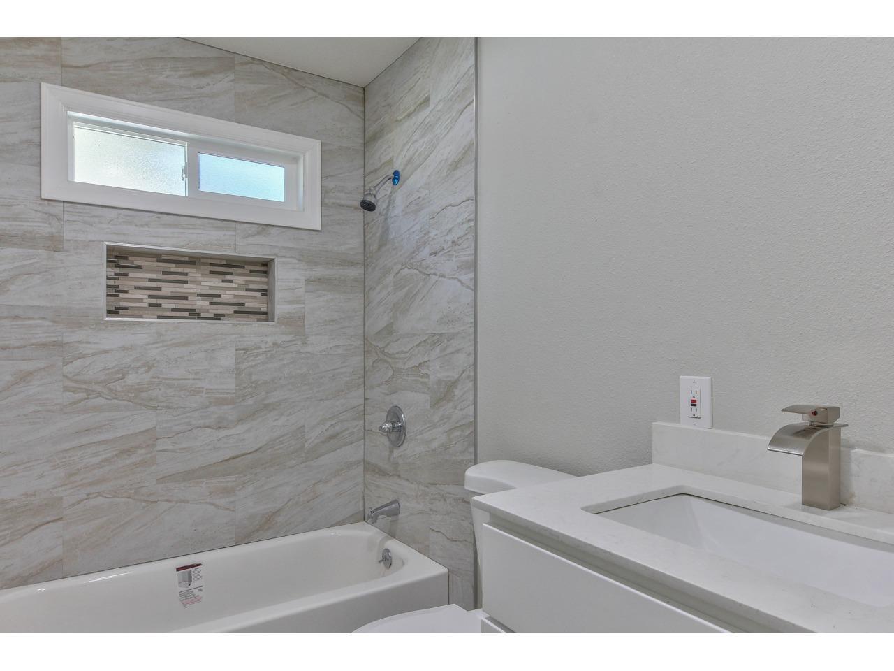 19265 Mallory Canyon Road Salinas, CA 93907 - Photo 9 of 17 a bathroom with a sink a toilet and shower