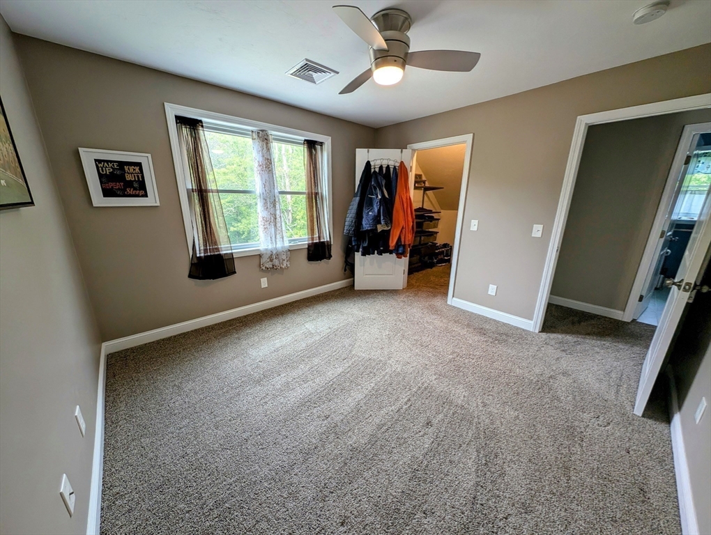 74 Baker Pond Road Dudley, MA 01571 - Photo 16 of 42 a view of empty room with windows