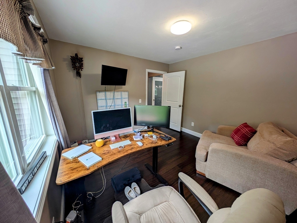 74 Baker Pond Road Dudley, MA 01571 - Photo 18 of 42 a bedroom with a bed and a flat screen tv