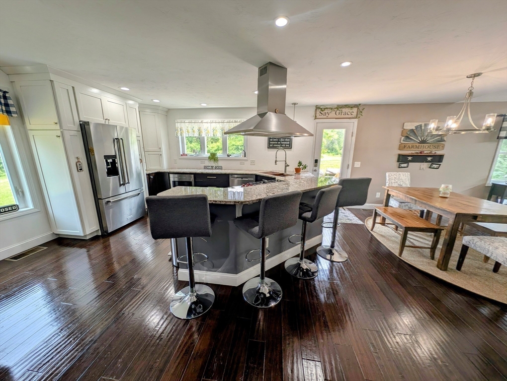 74 Baker Pond Road Dudley, MA 01571 - Photo 20 of 42 a view of a dining room with furniture window and wooden floor