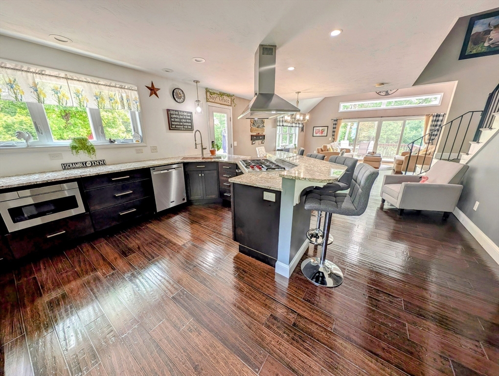 74 Baker Pond Road Dudley, MA 01571 - Photo 3 of 42 a living room with furniture windows and a wooden floor
