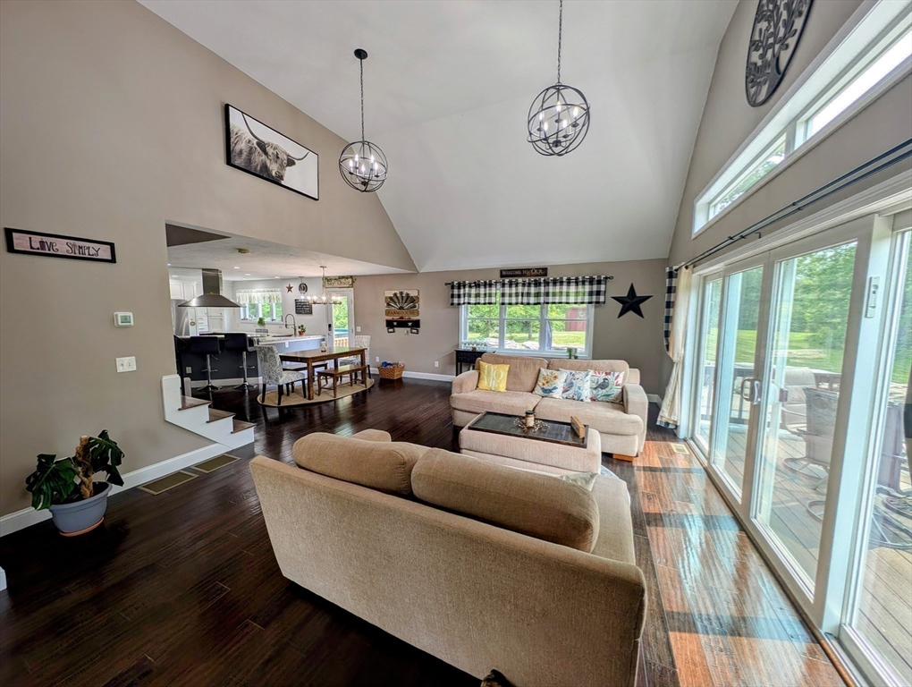 74 Baker Pond Road Dudley, MA 01571 - Photo 33 of 42 a living room with furniture and a large window