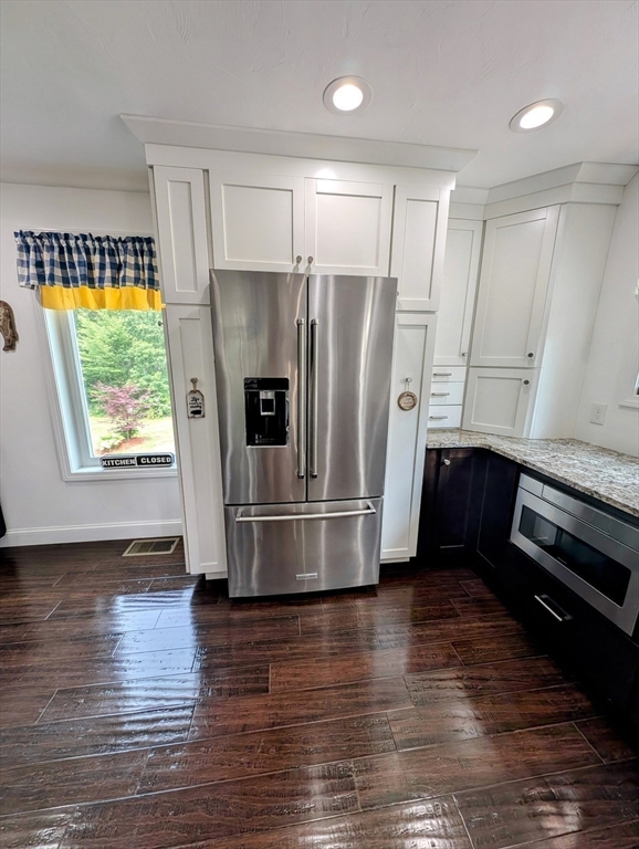 74 Baker Pond Road Dudley, MA 01571 - Photo 35 of 42 a kitchen with stainless steel appliances a refrigerator sink and cabinets