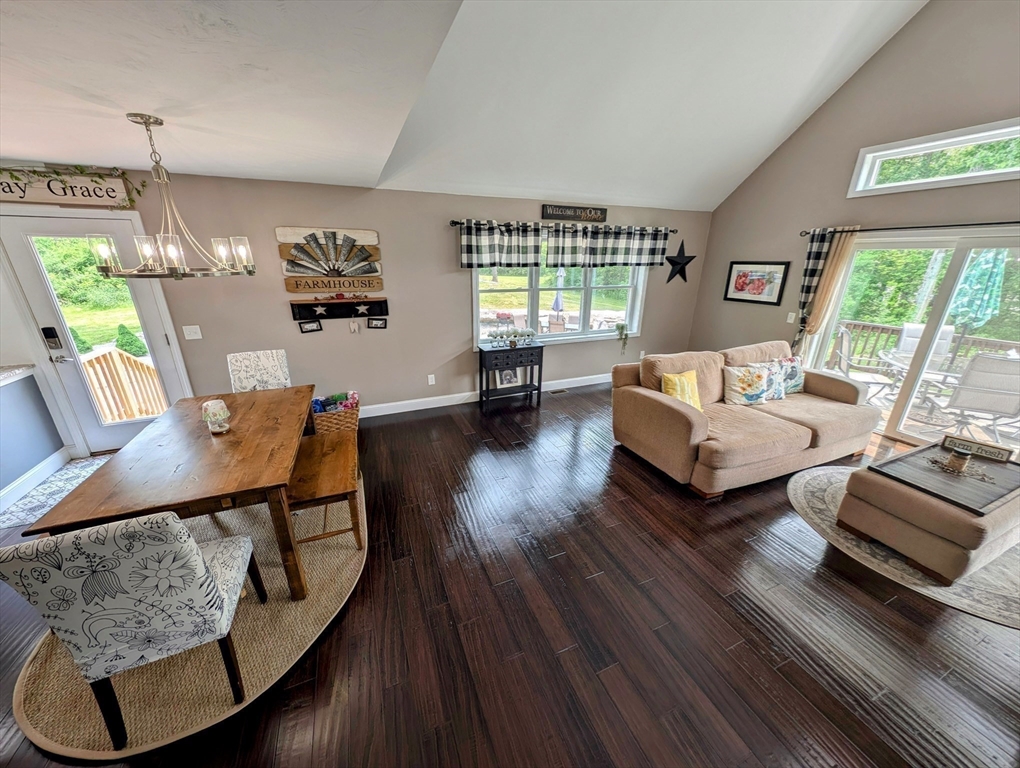 74 Baker Pond Road Dudley, MA 01571 - Photo 8 of 42 a living room with furniture and a wooden floor
