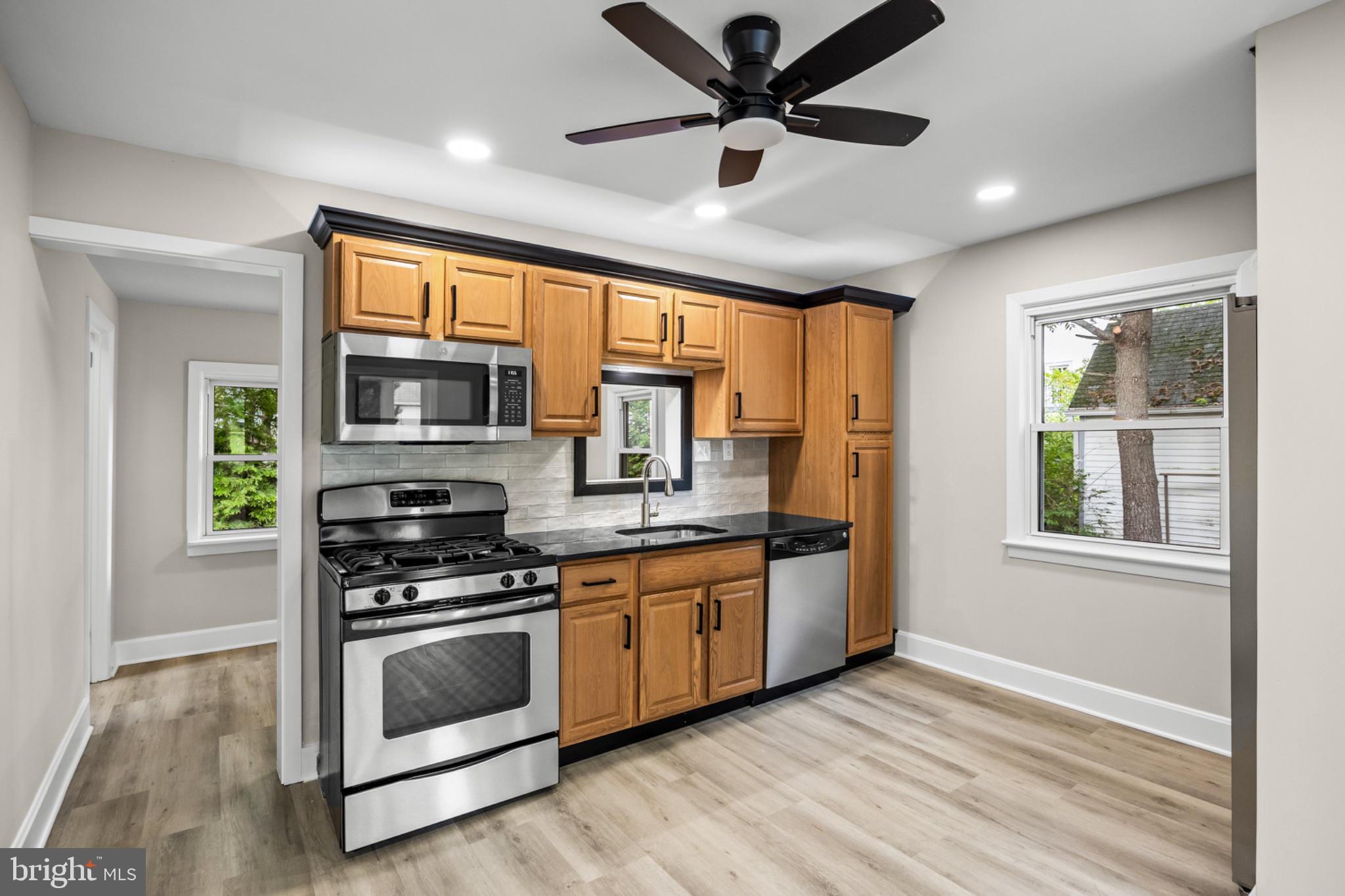 75 Egbert Street Pemberton, NJ 08068 - Photo 20 of 43 Modern kitchen with warm wood accents.
