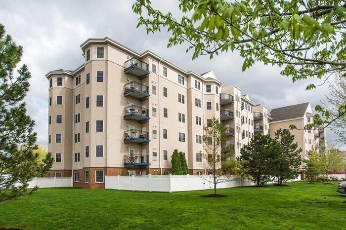 front view of a building with a yard