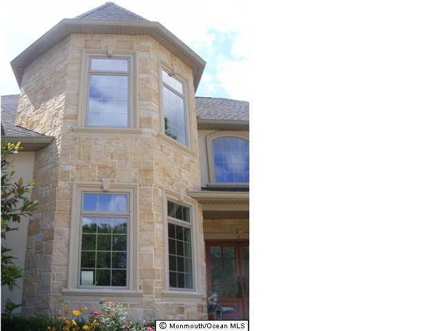 36 Laird Road Colts Neck, NJ 07722 - Photo 3 of 3 a front view of a house