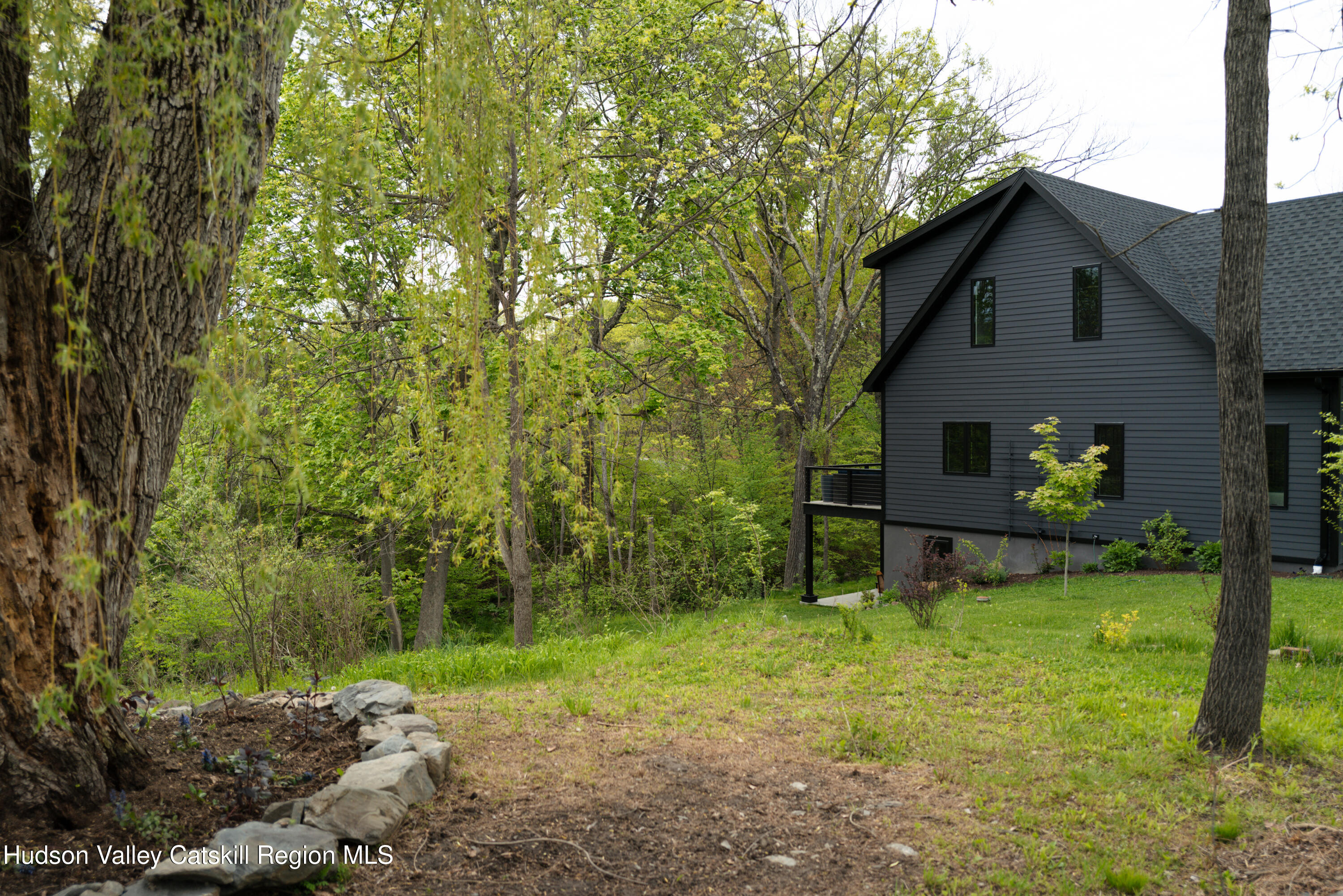 75 Cheviot Road Germantown, NY 12526 - Photo 24 of 30 a backyard of a house with table and chairs
