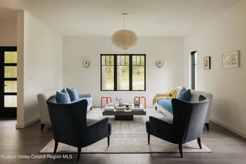 a living room with furniture and a window
