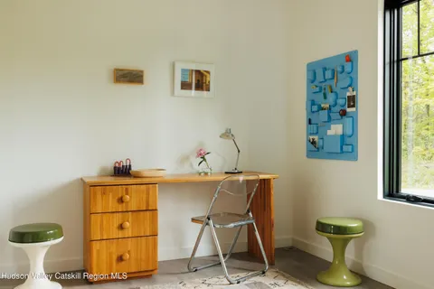 a workspace with furniture and window