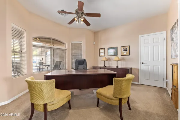 a view of a dining room with furniture and window
