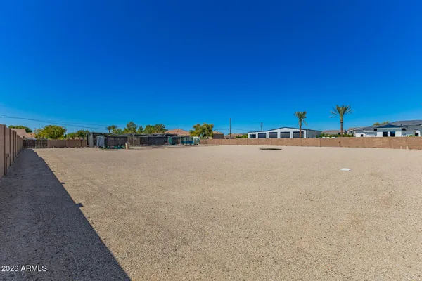 a view of a ocean with a building in the background