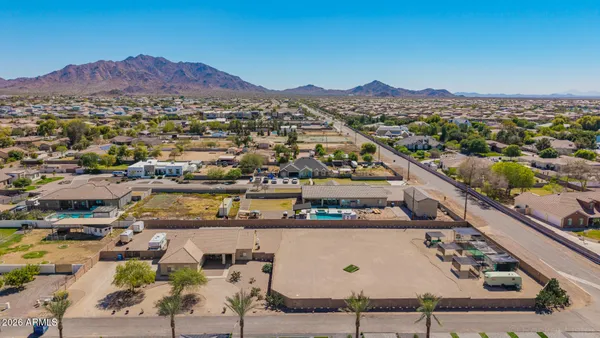 an aerial view of a house with a ocean view