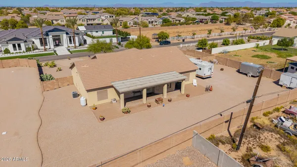 an aerial view of a house with a ocean view