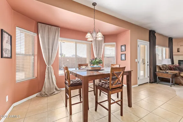 a view of a dining room with furniture window and outside view