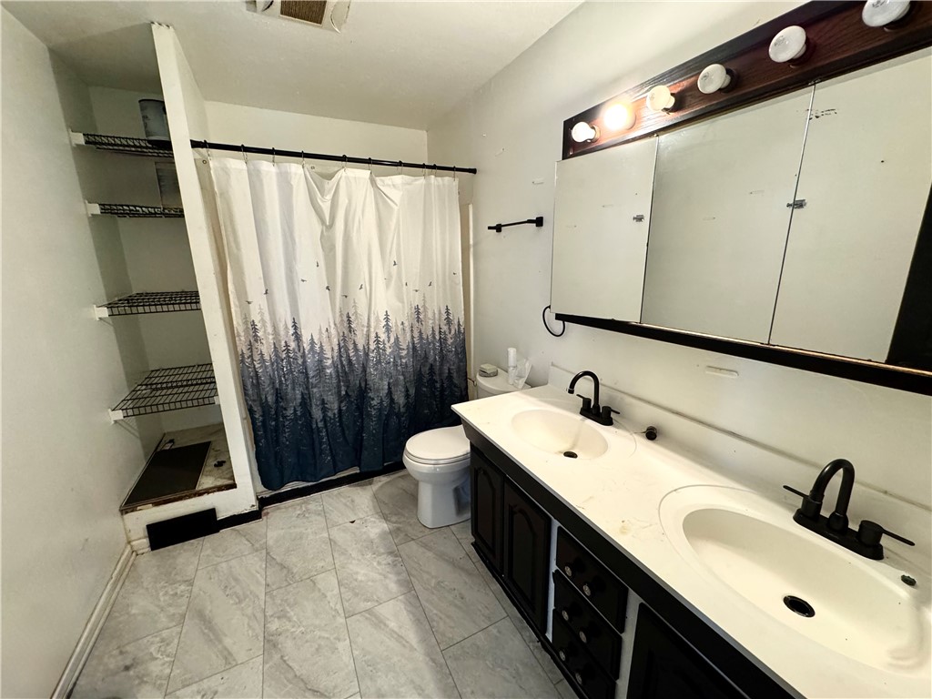 348 Fairview Avenue Hamilton, OH 45015 - Photo 7 of 9 A well-appointed bathroom features a practical double vanity and ample storage space.