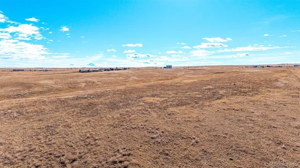 a view of an ocean and a yard