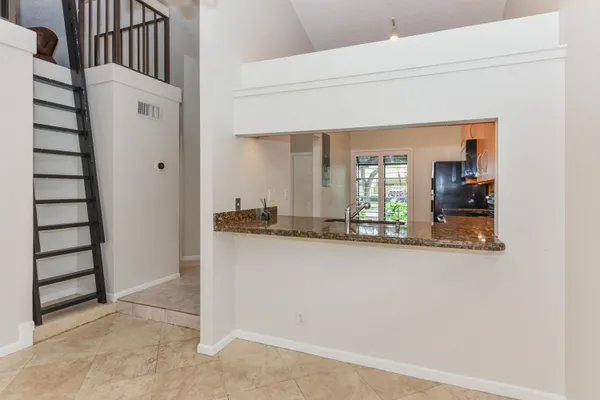 a view of a living room with entryway