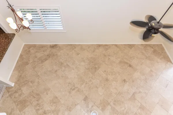 an empty room with large window