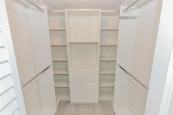 a hallway with a washer and dryer