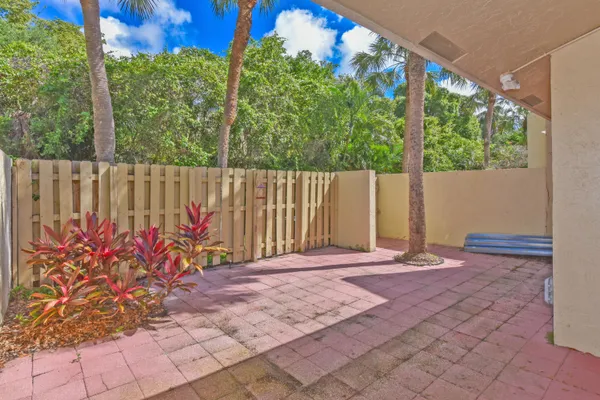 a view of a backyard with sitting area