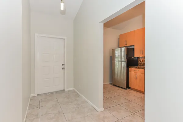 a view of a kitchen from the hallway