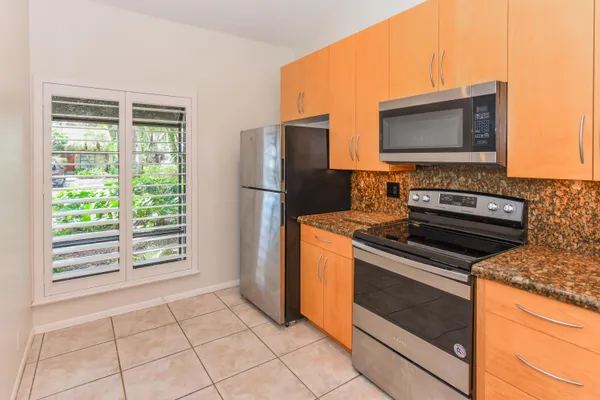 a kitchen with a stove microwave and refrigerator