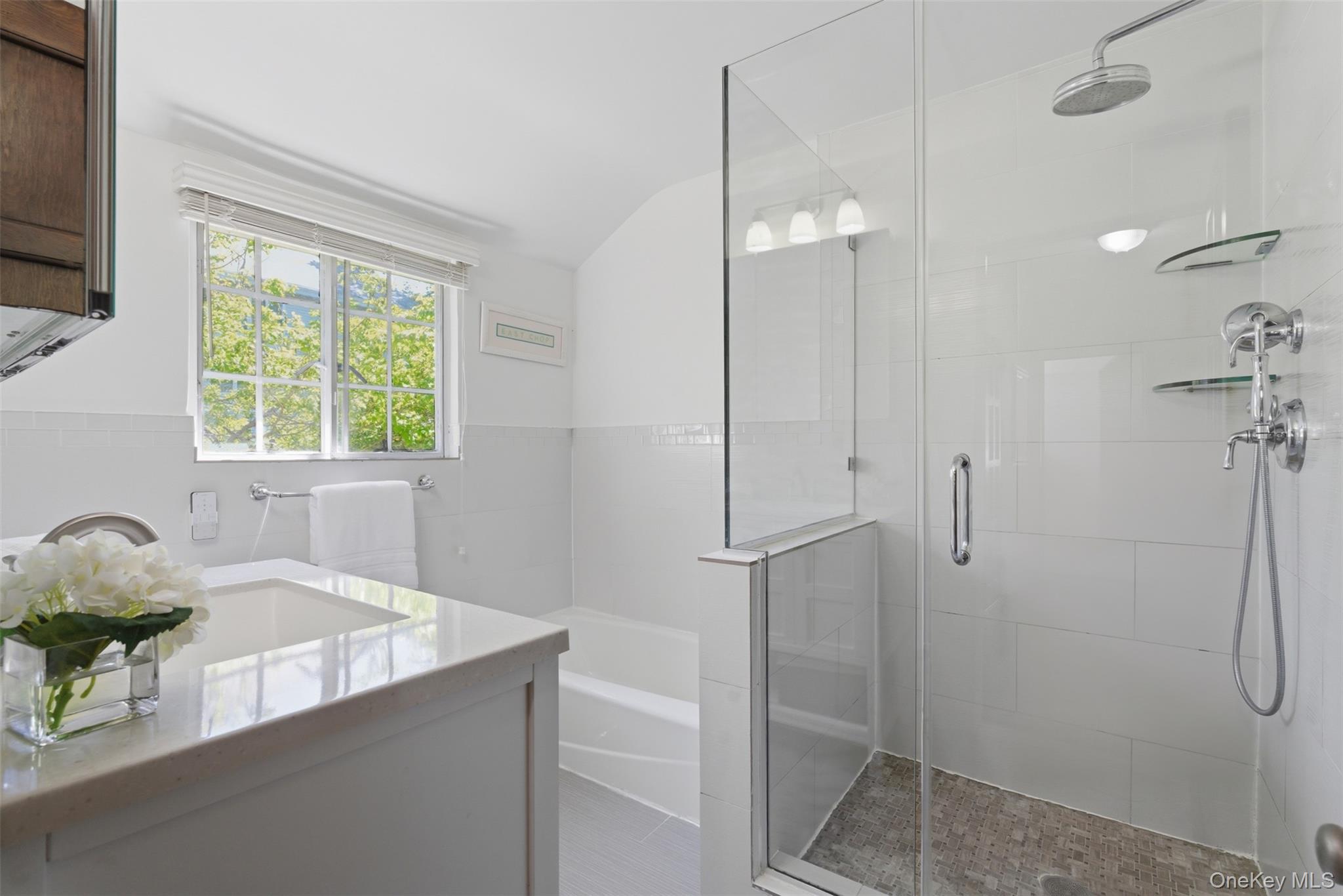 15 Kingsbury Road New Rochelle, NY 10804 - Photo 18 of 30 a bathroom with a tub sink and shower